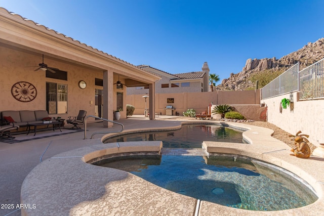 view of pool with ceiling fan and a patio