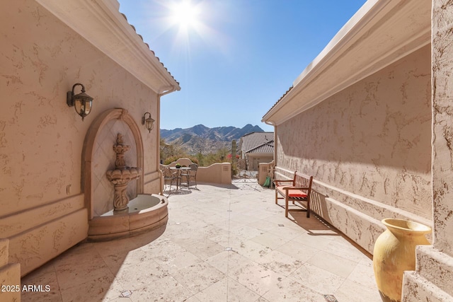 view of patio with a mountain view