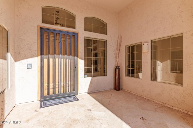 property entrance with a patio area