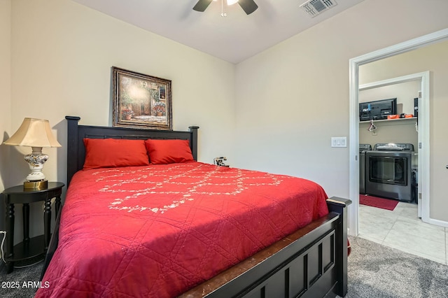 carpeted bedroom featuring washer and dryer, ceiling fan, and a spacious closet