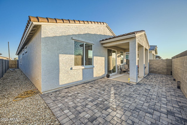 rear view of house featuring a patio area