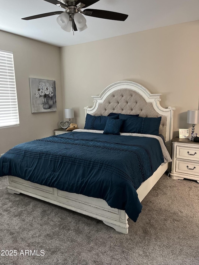 bedroom with ceiling fan and carpet