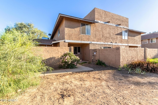 6902 W Devonshire Ave Unit 1280, Phoenix, AZ 85033 - back of property featuring stucco siding and fence