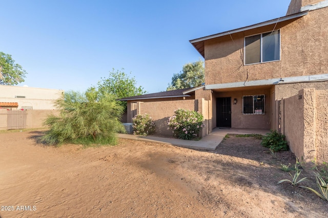 6902 W Devonshire Ave Unit 1280, Phoenix, AZ 85033 - rear view of property with fence and stucco siding