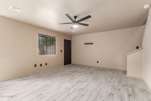 6902 W Devonshire Ave Unit 1280, Phoenix, AZ 85033 - spare room with ceiling fan, visible vents, and light wood-type flooring