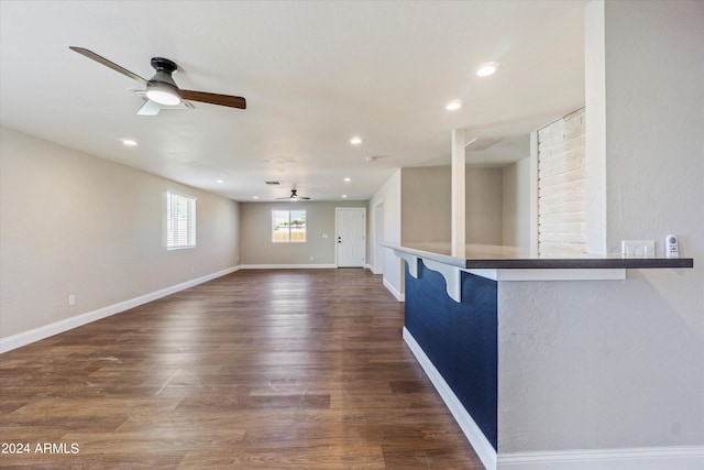 interior space featuring ceiling fan and dark hardwood / wood-style floors