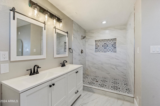 bathroom featuring vanity and a tile shower