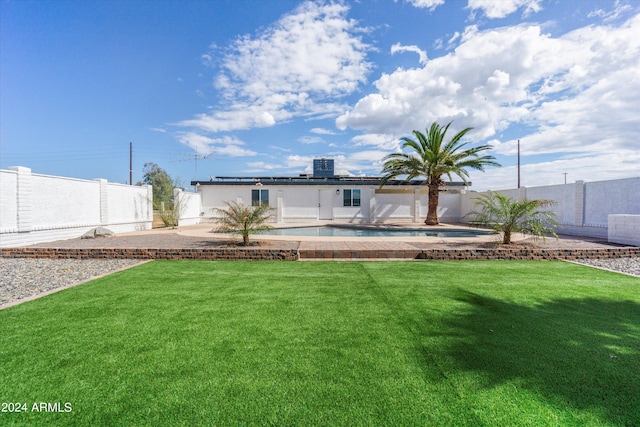 view of yard with a patio and a fenced in pool