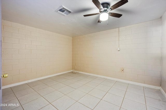 unfurnished room featuring tile patterned flooring and ceiling fan