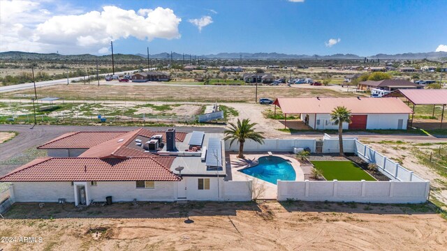 birds eye view of property featuring a mountain view