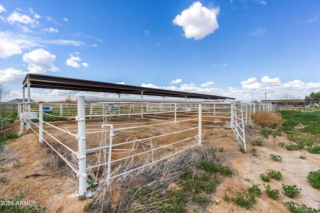 view of stable featuring a rural view