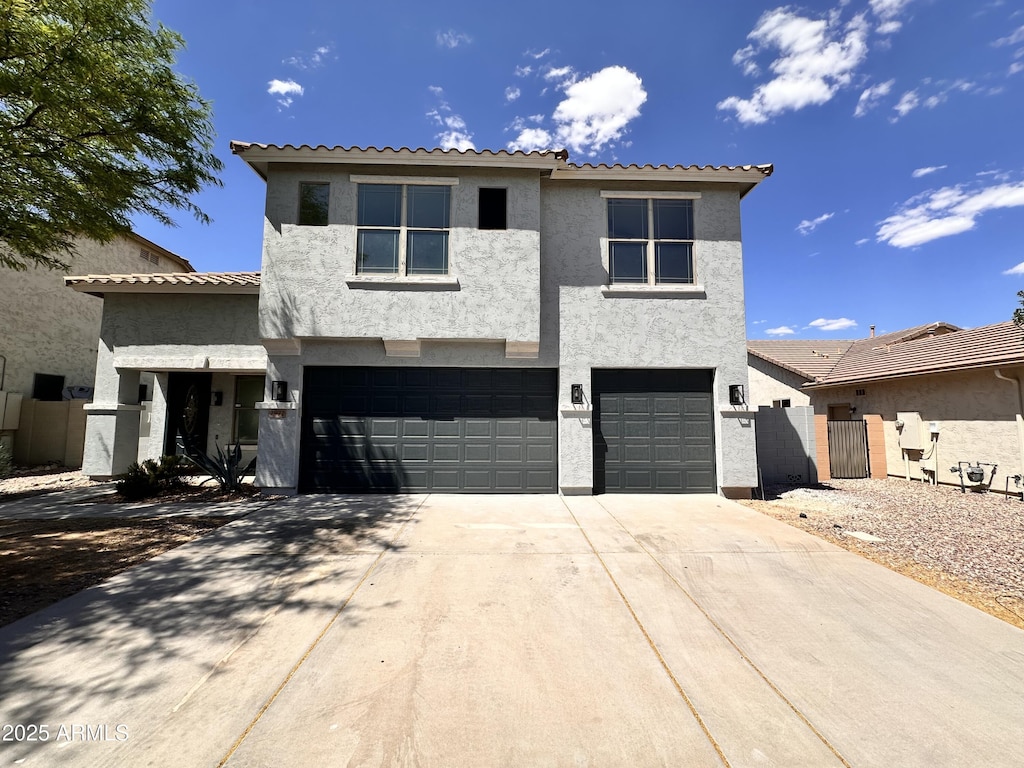 2972 W S Butte Rd, San Tan Valley, AZ 85144 - view of front of property featuring a garage, stucco siding, concrete driveway, and a tile roof