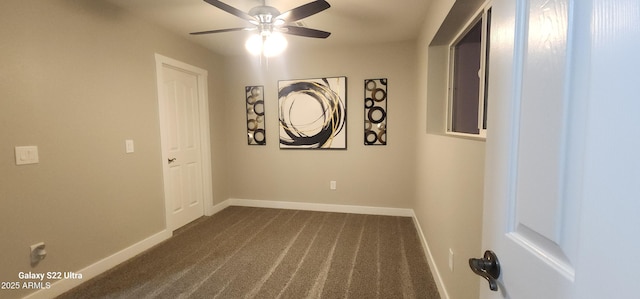 329 W Fairhaven Rd, Kearny, AZ 85137 - empty room featuring dark colored carpet, ceiling fan, and baseboards