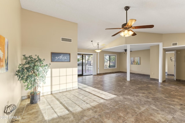 unfurnished living room with ceiling fan, french doors, and vaulted ceiling