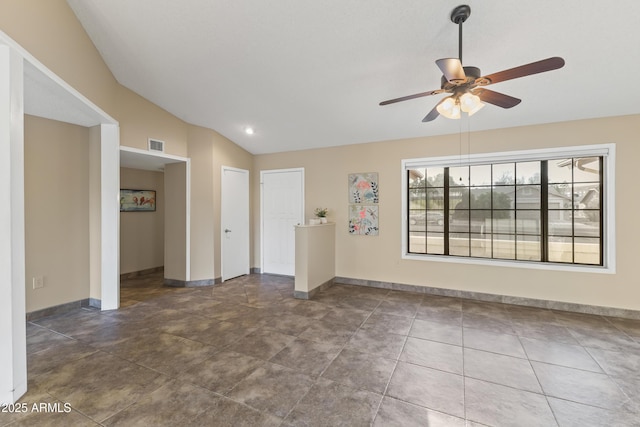 spare room with ceiling fan and vaulted ceiling