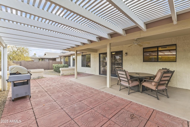 view of patio with ceiling fan, a pergola, and grilling area