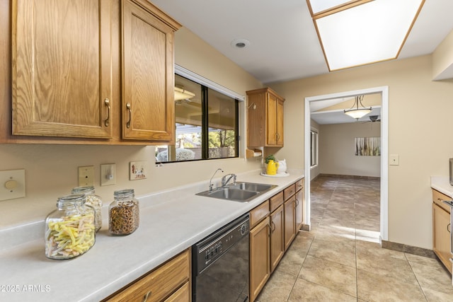 kitchen with dishwasher, light tile patterned floors, and sink