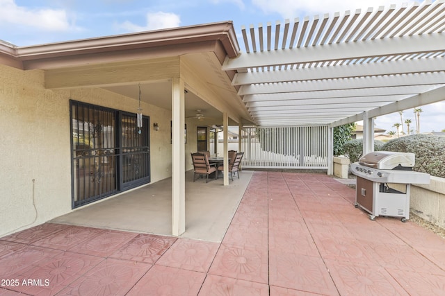 view of patio / terrace with a pergola and area for grilling