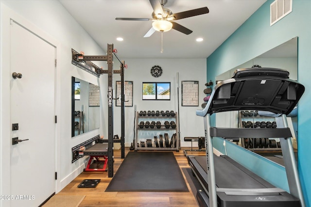 exercise room with hardwood / wood-style flooring and ceiling fan