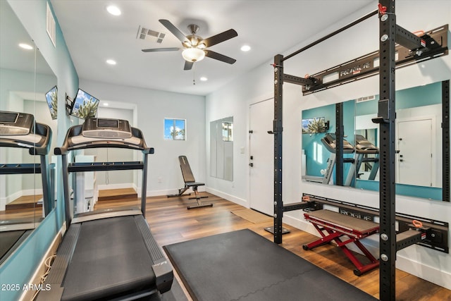 exercise room with hardwood / wood-style flooring and ceiling fan