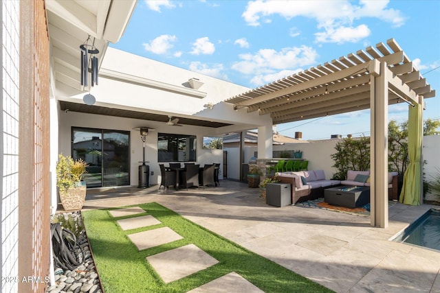 view of patio / terrace featuring a pergola and an outdoor living space with a fire pit