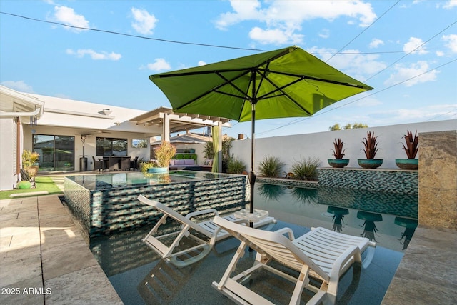 view of patio with area for grilling and an outdoor bar