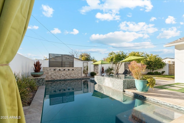 view of pool featuring area for grilling and a patio area