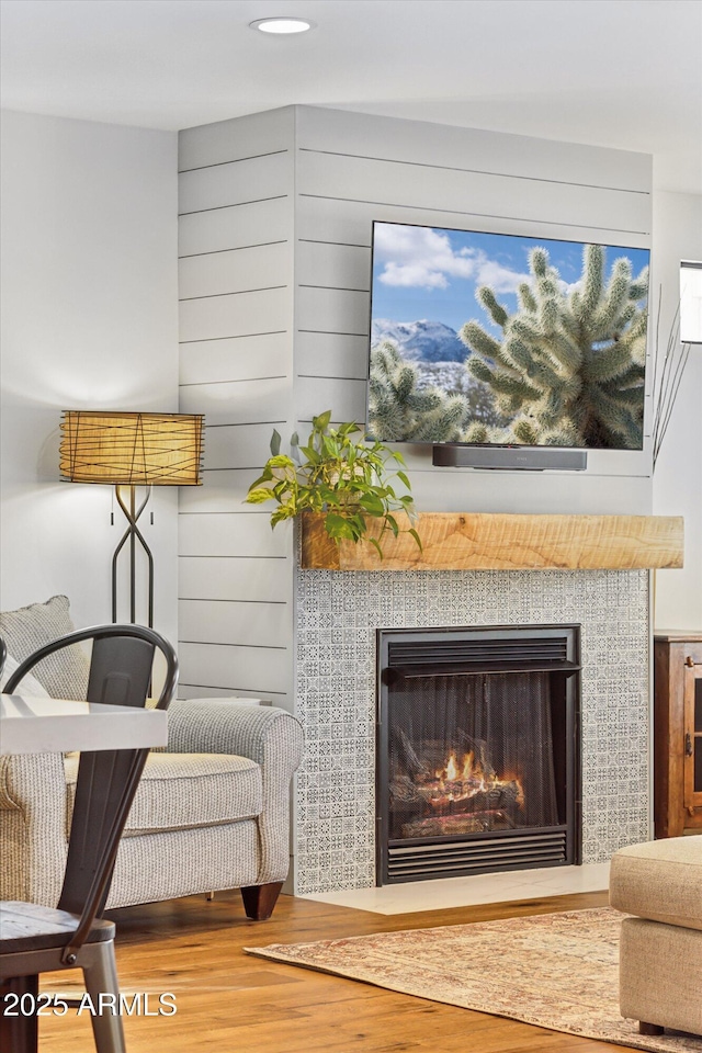 details with hardwood / wood-style floors and a fireplace