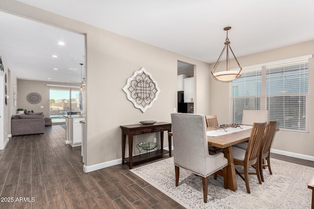 dining room featuring recessed lighting, dark wood finished floors, and baseboards