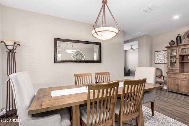 dining room with visible vents and wood finished floors