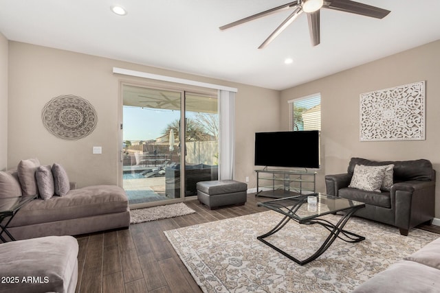 living area featuring dark wood-style floors, baseboards, a ceiling fan, and recessed lighting