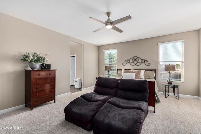 bedroom with light carpet and baseboards