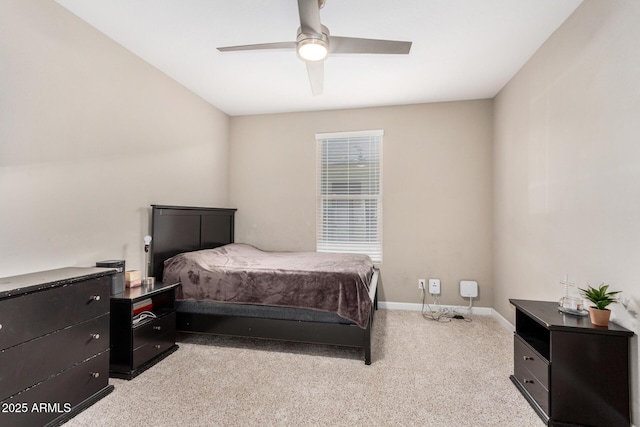 bedroom with light carpet, ceiling fan, and baseboards