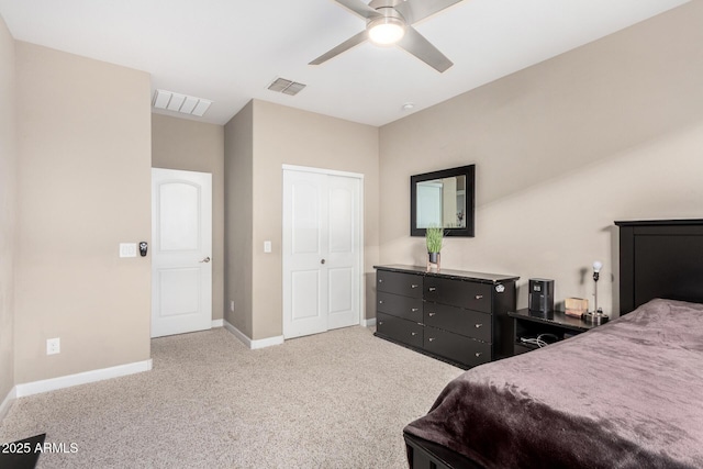 bedroom with baseboards, ceiling fan, visible vents, and light colored carpet