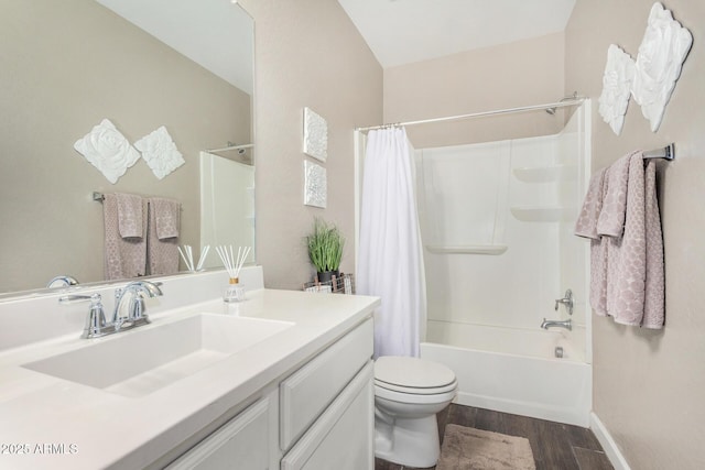 full bath with toilet, wood finished floors, vanity, baseboards, and shower / bathtub combination with curtain