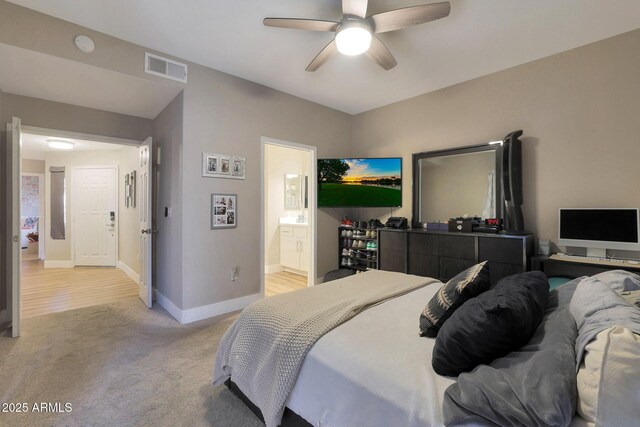 15050 N Thompson Peak Pkwy Unit 2072, Scottsdale, AZ 85260 - bedroom featuring light carpet, baseboards, connected bathroom, and ceiling fan