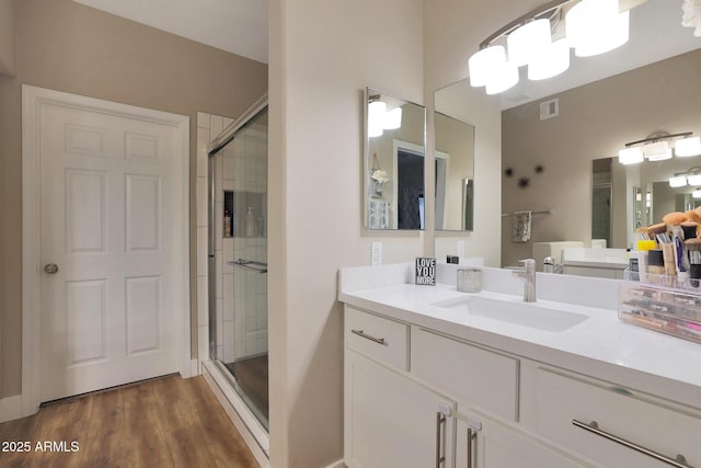 15050 N Thompson Peak Pkwy Unit 2072, Scottsdale, AZ 85260 - full bathroom with a shower stall, vanity, and wood finished floors