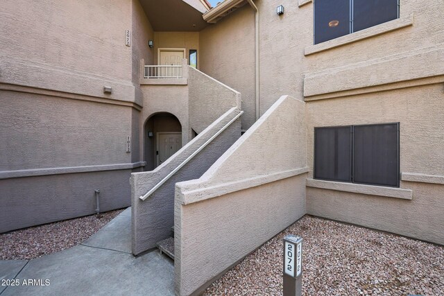 15050 N Thompson Peak Pkwy Unit 2072, Scottsdale, AZ 85260 - exterior space featuring stucco siding and a balcony