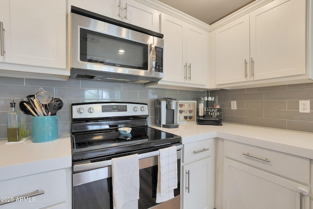 15050 N Thompson Peak Pkwy Unit 2072, Scottsdale, AZ 85260 - kitchen featuring stainless steel appliances, light countertops, white cabinetry, and backsplash