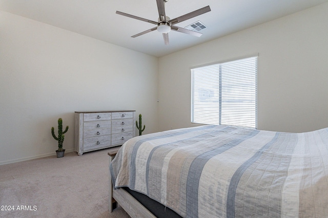 bedroom with light carpet and ceiling fan