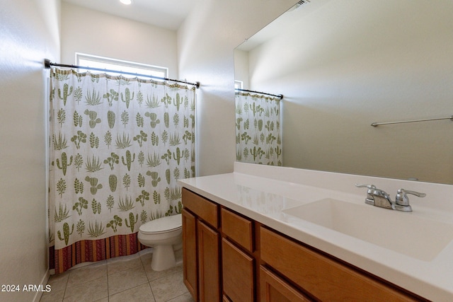 full bathroom featuring tile patterned flooring, shower / tub combo, vanity, and toilet