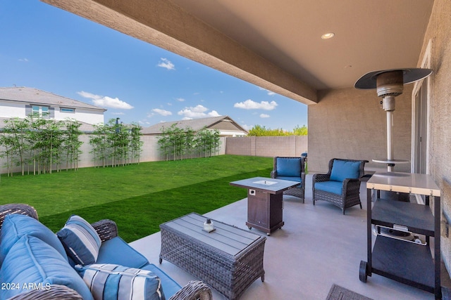 view of patio featuring an outdoor living space with a fire pit