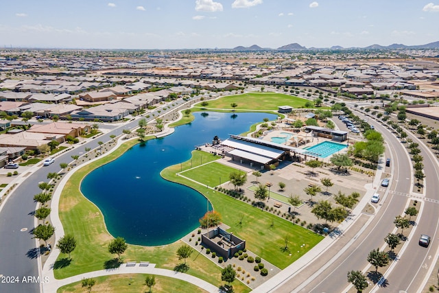 drone / aerial view with a water and mountain view