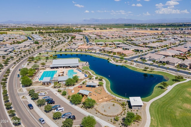 drone / aerial view featuring a water and mountain view