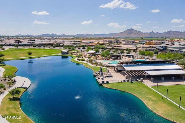 drone / aerial view featuring a water and mountain view