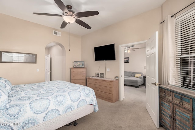 14575 W Mountain View Blvd Unit 12309, Surprise, AZ 85374 - bedroom featuring arched walkways, light carpet, and ceiling fan