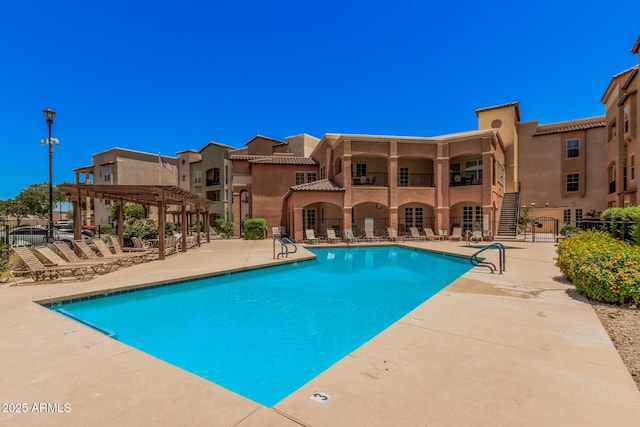 14575 W Mountain View Blvd Unit 12309, Surprise, AZ 85374 - community pool featuring a pergola, a patio area, and a residential view