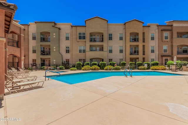 14575 W Mountain View Blvd Unit 12309, Surprise, AZ 85374 - community pool featuring a patio