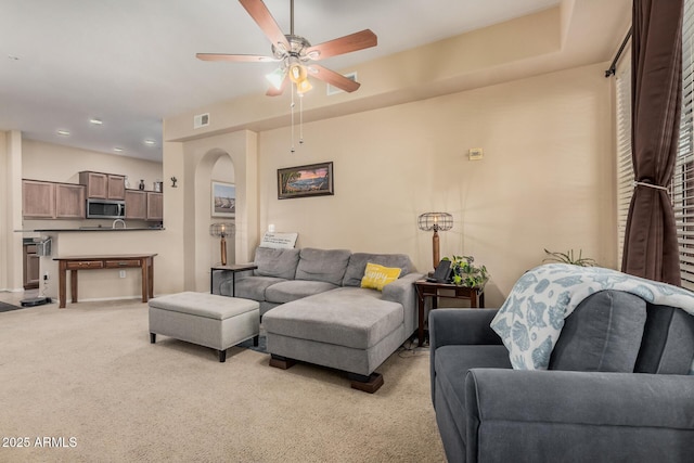14575 W Mountain View Blvd Unit 12309, Surprise, AZ 85374 - living area with light carpet, ceiling fan, recessed lighting, and arched walkways