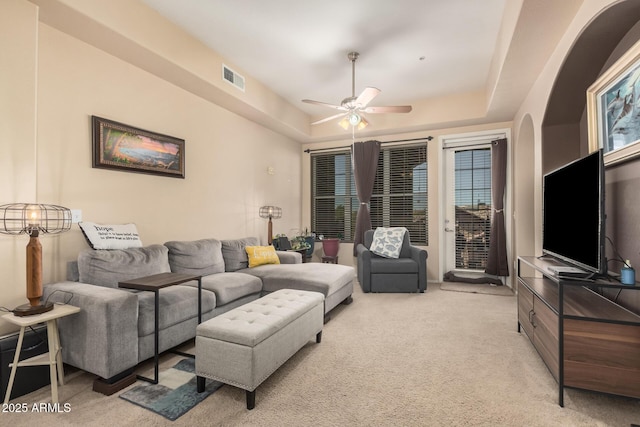 14575 W Mountain View Blvd Unit 12309, Surprise, AZ 85374 - living room featuring light carpet, a ceiling fan, and a raised ceiling